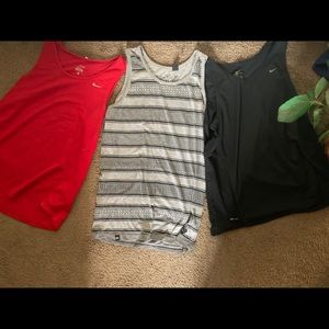 2 Nike and one other Tank Top